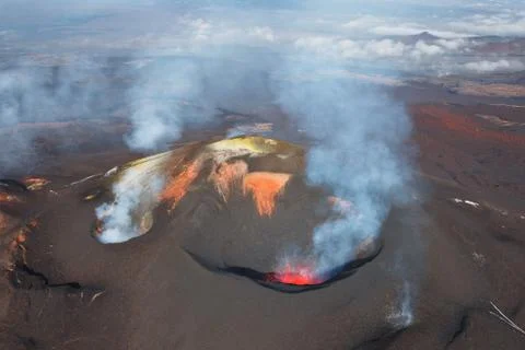 Volcano exploding in the day Stock Photos