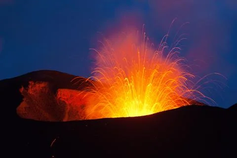 Volcano exploding in the  night Stock Photos