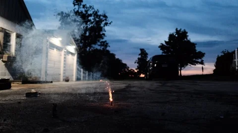 Volcano fountain firework in backyard. Static. Blurry. Slow motion Stock Footage 112147061