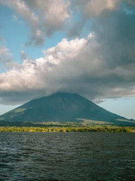 Volcano on an island Stock Photos