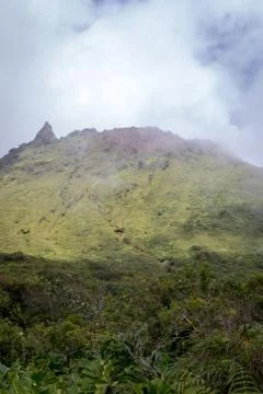 Volcano La Soufriere in clouds. Active volcano in the tropical island Guadeloupe Stock Photos