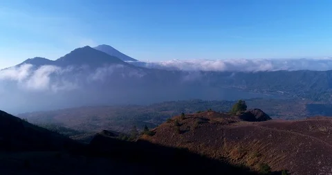 Volcano with lake at the bottom and edge of another with smoke Video stock 114587077