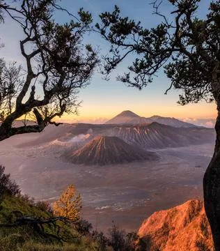 Volcano mount an active with tree frame at sunrise Stock-Fotos