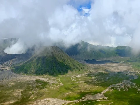 Volcano Mount Bromo emitting white smoke and dust Stock Footage 74382248