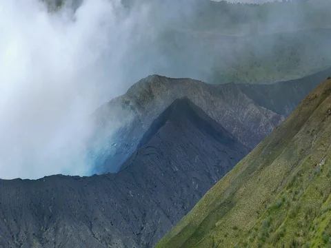 Volcano Mount Bromo emitting white smoke and dust during eruption. Indonesia Stock-Footage 74385363