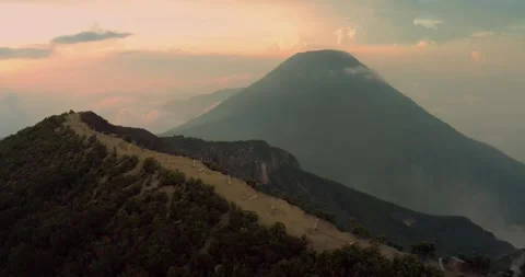 Volcano Peak Emerging Through Golden Haze in Indonesia Stock Footage 329077523
