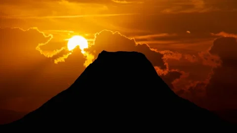 Volcano Skyline at Sunset, Time Lapse with Red Sun and Fiery Sky Stock Footage 201098030