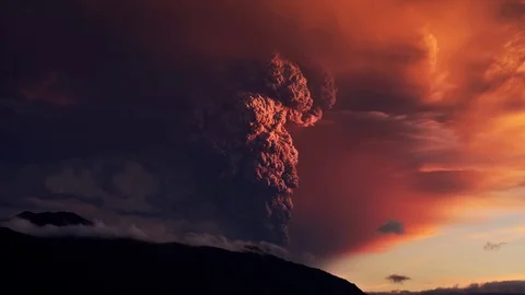 The volcano woke up and throws hot ashes 128334463