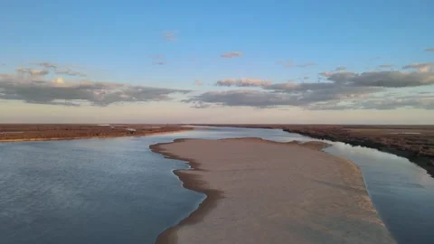 Volga Flight at sunset over the river in the sky with clouds in early spring Video stock 198130135