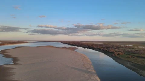 Volga Flight at sunset over the river in the sky with clouds in early spring Video stock 198130332