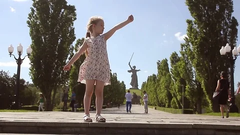 Volgograd, Russia - May 29, 2017: Beautiful girl pose on Mamayev Kurgan near The Stock Footage