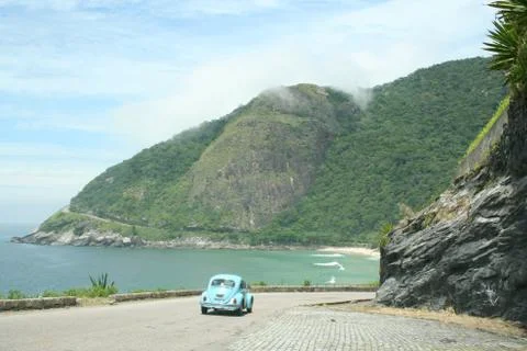 Volkswagon Bug | VW Beetle driving on mountain to the ocean Stock Photos