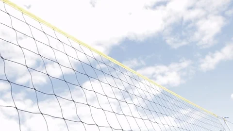 Volleyball being passed over the net during outdoor volleyball tournament Stock Footage 107629164