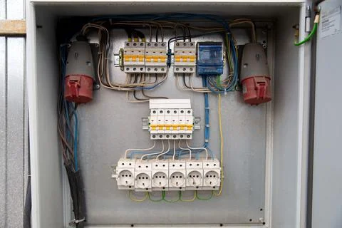 Voltage switchboard with circuit breakers and outlets in power board. Electrical Stock Photos