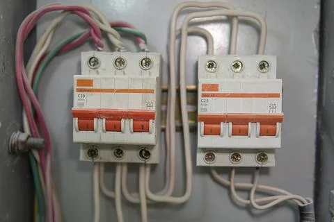 Voltage switchboard with circuit breakers. Electrical background. Stock Photos