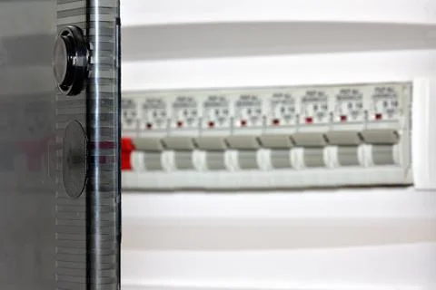 Voltage switchboard with circuit breakers. Low depth of field. Stock Photos
