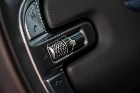 Volume and audio control buttons on the steering wheel. Car audio controls Stock Photos