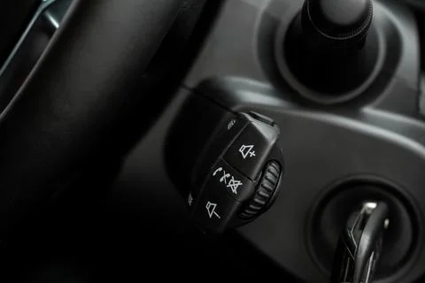 Volume and audio control buttons on the steering wheel. Car audio controls 스톡 사진