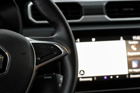 Volume and audio control buttons on the steering wheel. Car audio controls 스톡 사진