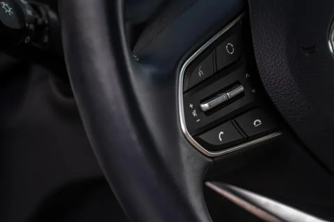 Volume and audio control buttons on the steering wheel. Car audio controls Foto stock