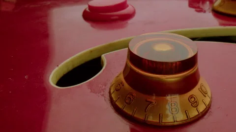 Volume and Tone Control Knobs on a Red Electric Guitar Stock Footage 283468550