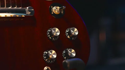 Volume and tone knobs on an SG guitar model, moving left to right. [4K] 스톡 동영상 152582369