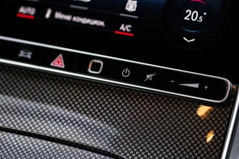 Volume control of car audio system. FM radio button in car panel. Stock Photos