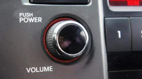 Volume control in the car, volume button. Stock Photos