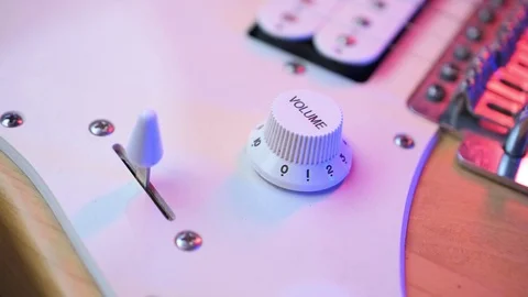 Volume knob dial in setting adjustment on a electric guitar Video stock 119580808