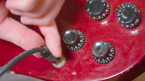 Volume knobs on electric guitar being handled Video stock 144278668