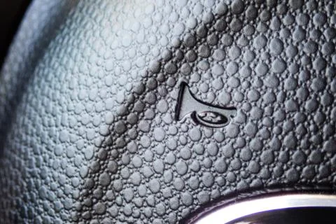 VOLUME SOUND button inside a car. Crop fragment. 库存照片