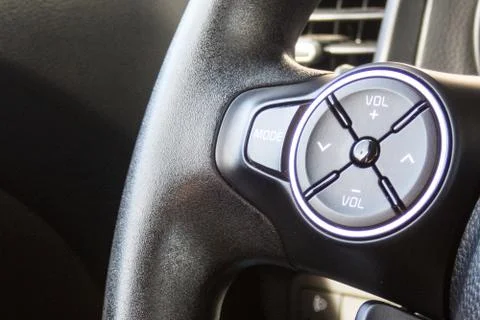 VOLUME SOUND button inside a car. Crop fragment. Photos