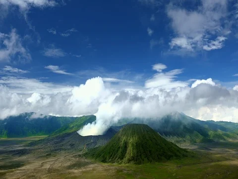 Volumes of gases emitted from vent of active Bromo volcano. Java Indonesiia Stock Footage