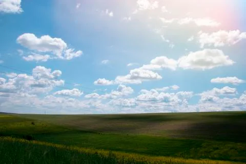 Voluminous white clouds in the blue sky, beautiful summer landscape Stock Photos