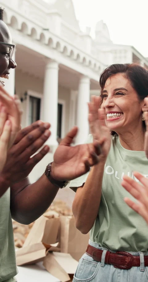 Volunteer, success and hand stack with team, social responsibility and Stock Footage 348023387