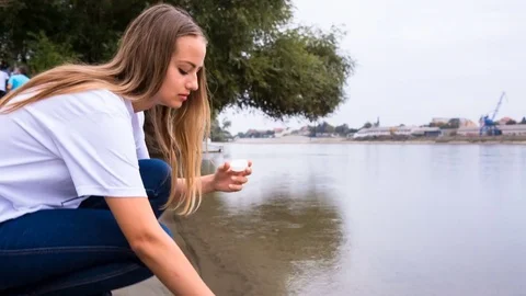 Volunteer with water sample Stock Footage 76674601