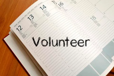 Volunteer write on notebook Stock Photos