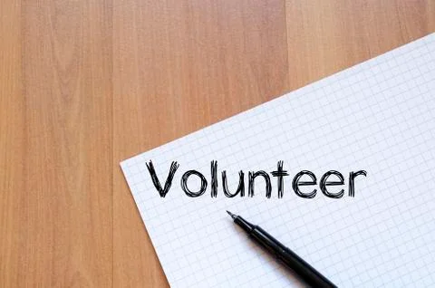 Volunteer write on notebook Stock Photos