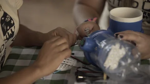 Volunteers Assembling Litro de Luz Solar Bottle Light, Conde, Paraíba Stock Footage 320571759