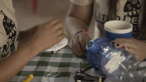 Volunteers Assembling Litro de Luz Solar Bottle Light, Conde, Paraíba Stock Footage 320571761