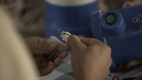 Volunteers Assembling Litro de Luz Solar Bottle Light, Conde, Paraíba Stock Footage 320571781