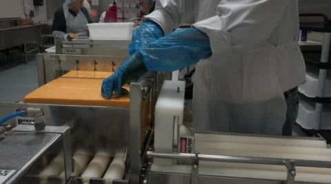 Volunteers cutting wrapping cheese for charity HD 017 Stock Footage 39622453