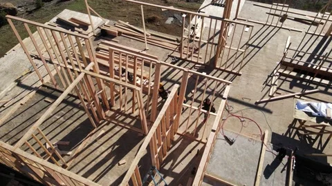 Volunteers lifting a wall at a construction yard Stock-Footage 228794878