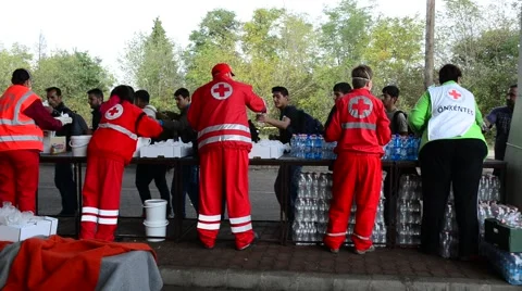 Volunteers from Red cross distributing help for refugees in Hungar Stock Footage 60706021