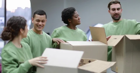 Volunteers sorting clothes donations Stock Footage 86826758