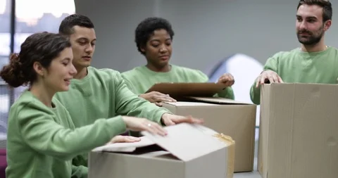 Volunteers sorting clothes donations Stock Footage 86827927