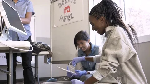 Volunteers sorting technology donations in community center Video stock 221041137