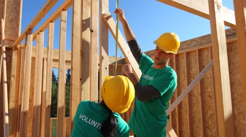 Volunteers working together on construction project Stock Footage 47541900