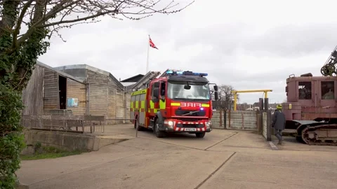 A Volvo modern fire engine on location by a river responding to a emergency Stock Footage 188496778