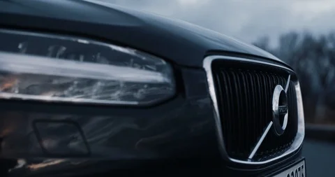 Volvo XC90 starts engine, headlights activate and go in to driving Stock Footage